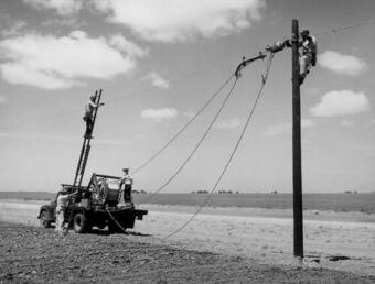 Rural Electrification Administration (REA) erects telephone lines in rural areas.